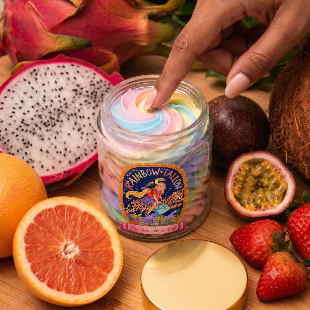 Finger dipping into a jar of rainbow whipped tallow
