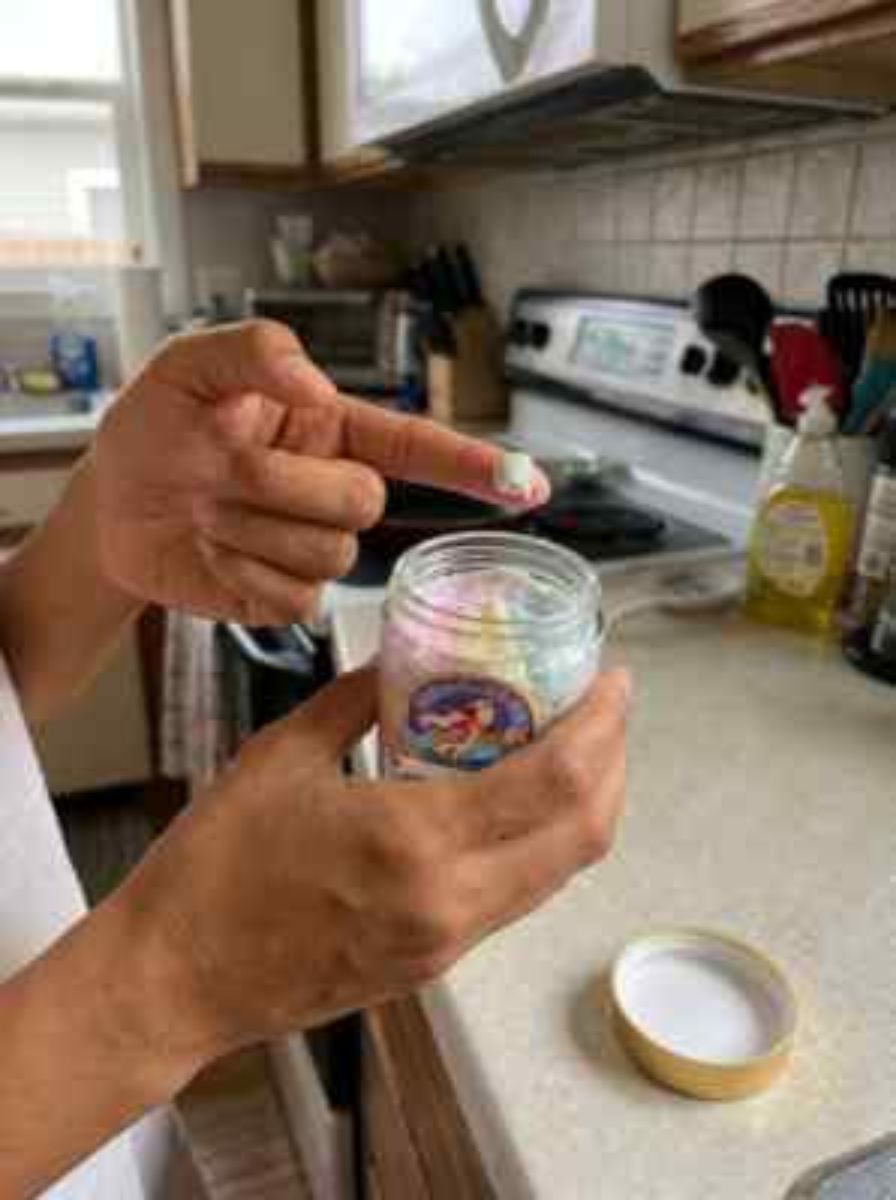 Step 2: Scoop one bean-size dab with your fingertip.